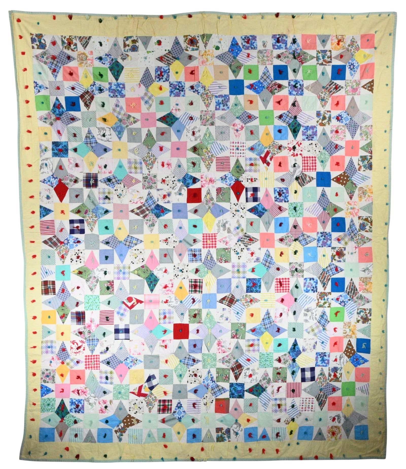 Scrap Patch Star Folk Quilt: Scrap Patch Star Folk Quilt. Hand pieced scrap quilt composed of multicolored cotton patches arranged in alternating star and square blocks and finished with a pale yellow border and tied throughout