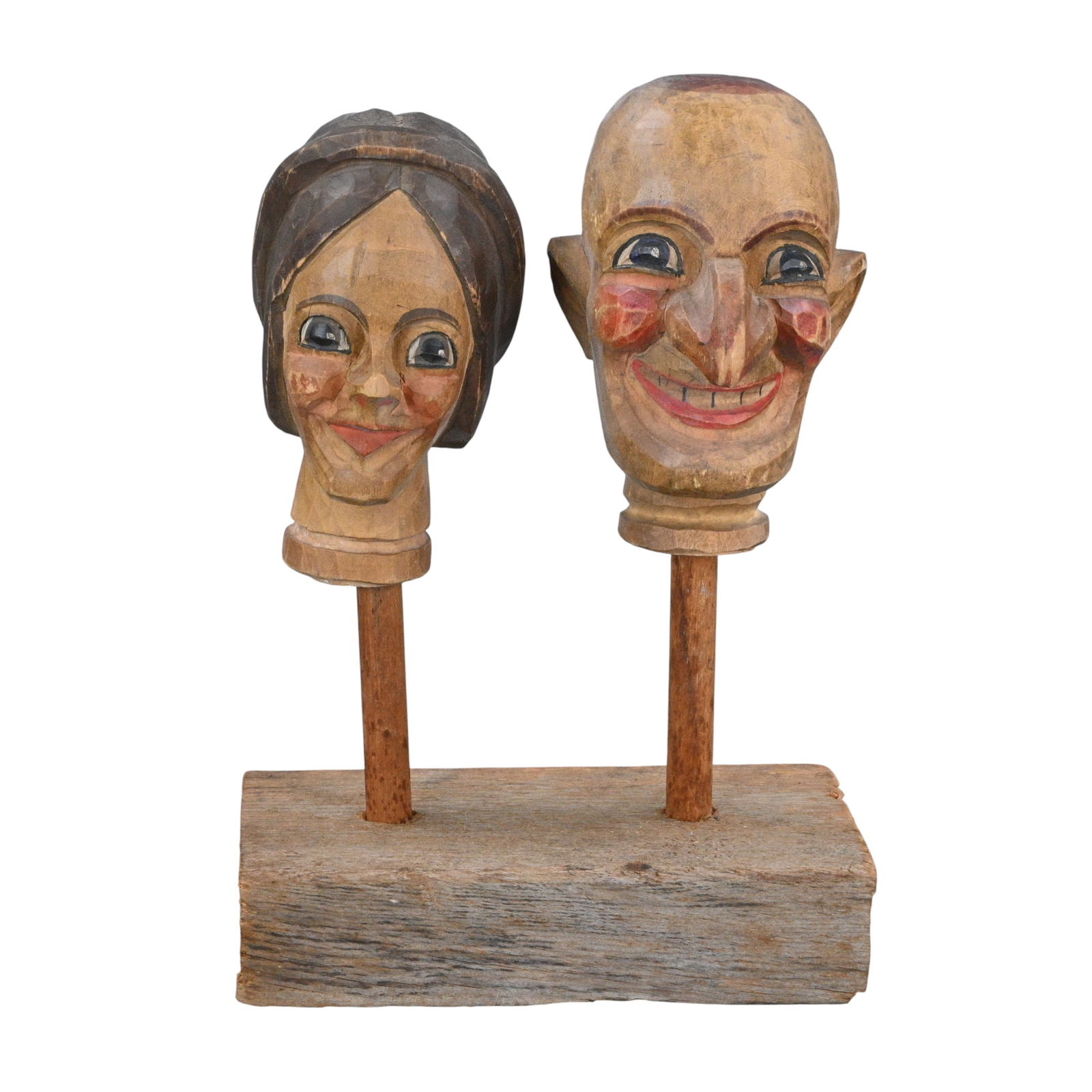 Pair of Antique Carved and Painted Wooden Punch Heads: Pair of Antique Carved and Painted Wooden Punch Heads. A pair of antique carved and painted wooden punch heads, depicting expressive male and female carnival characters. Retaining early paint with age