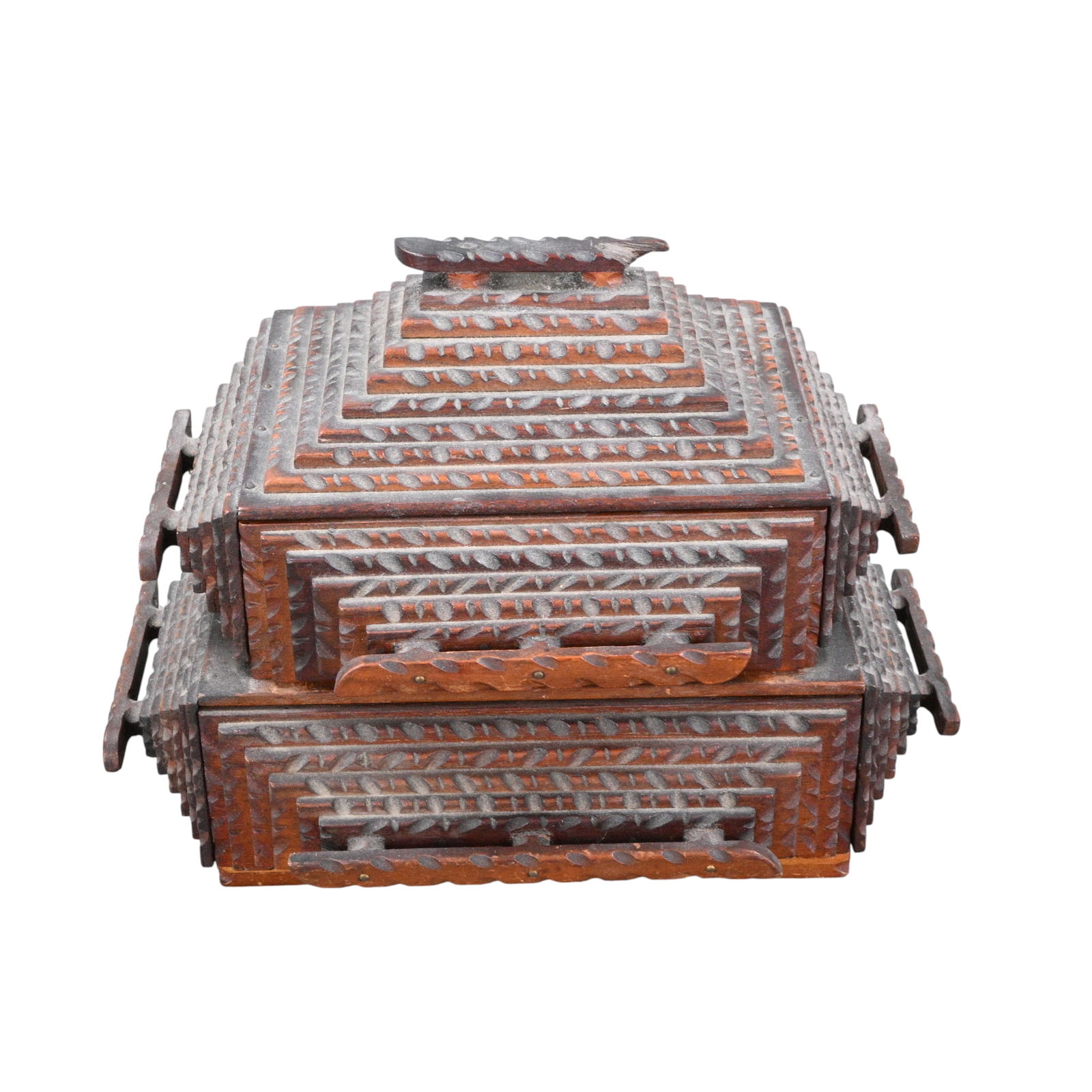 Architectural Tramp Art Jewelry Box: Architectural Tramp Art Jewelry Box. An architecturally formed tramp art jewelry box, densely chip-carved in layered geometric patterns across the sides and stepped base. The pyramidal top and deeply