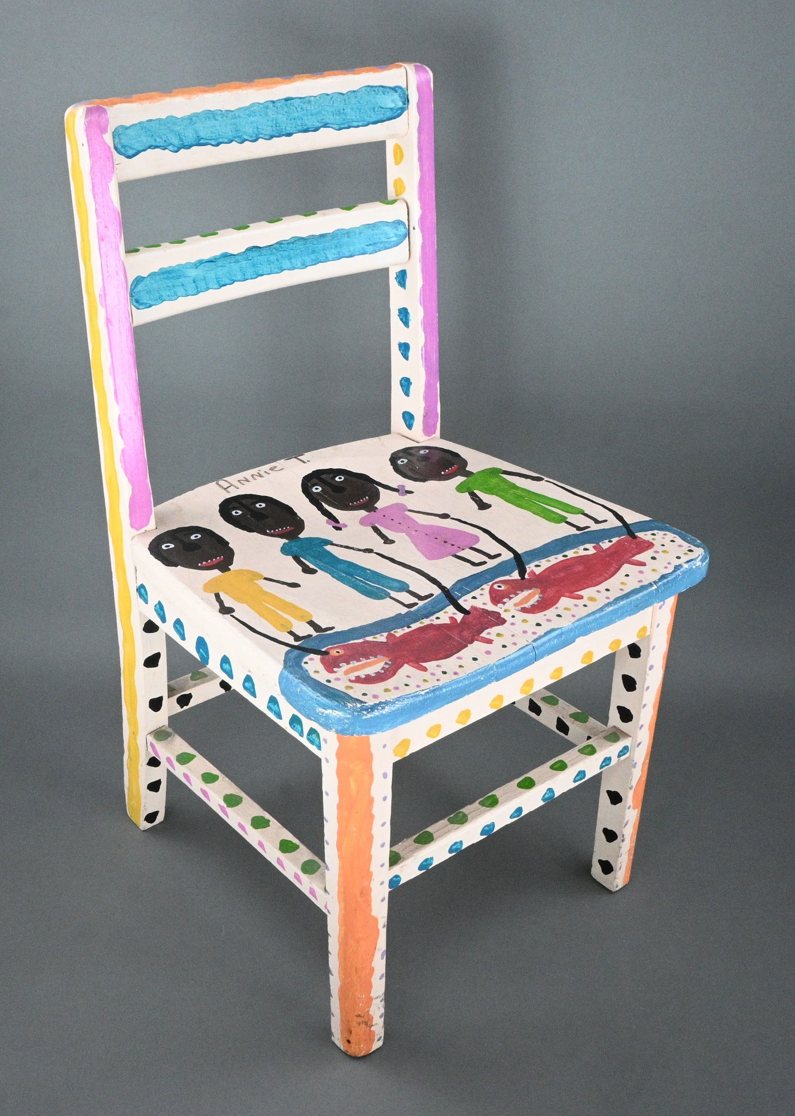 Annie Tolliver. Painted Chair: Annie Tolliver. (1950-2018) Painted Chair. Signed. "My Family Fishing". Antique child's chair. Excellent condition. Size: 24" H x 14.5" W x 13.25" D. Provenance: Micki Beth Stiller Collection. Purchas
