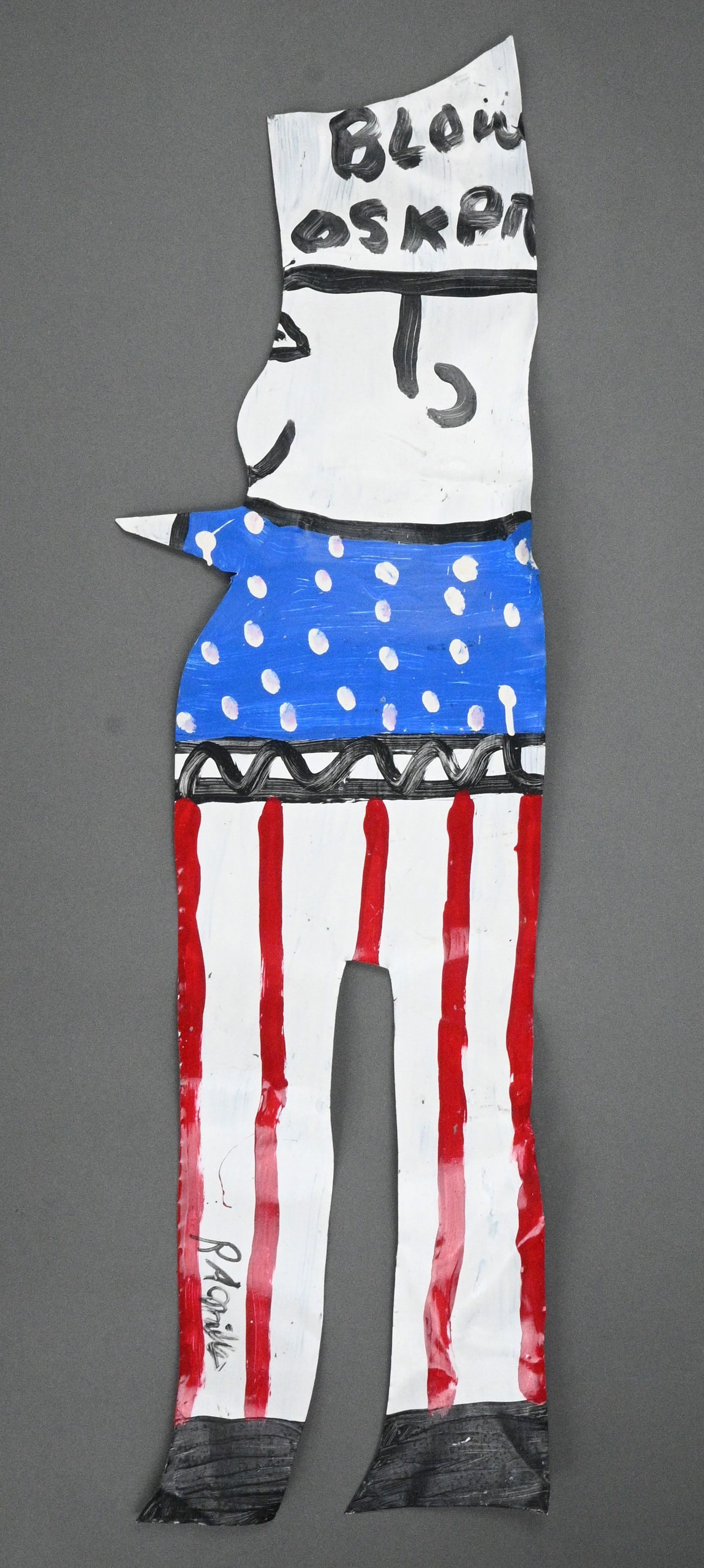 R.A. Miller. Blow Oskar: R.A. Miller. (1912-2006)Blow Oskar.Signed. Paint on tin cutout. Excellent condition. Size: 35" H x 10" W. Provenance: Micki Beth Stiller Collection. Est. $200 - $400. Ship: In-House