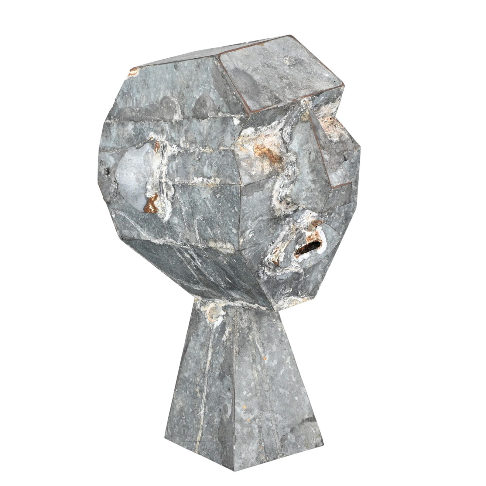 Sculptured Head-Sheet Metal: Sculptured Head-Sheet Metal. Galvanized sheet metal. The sculpture is hollow, with a weathered, unpainted surface. The stylized form looks different from every angle. It is of unknown age, but