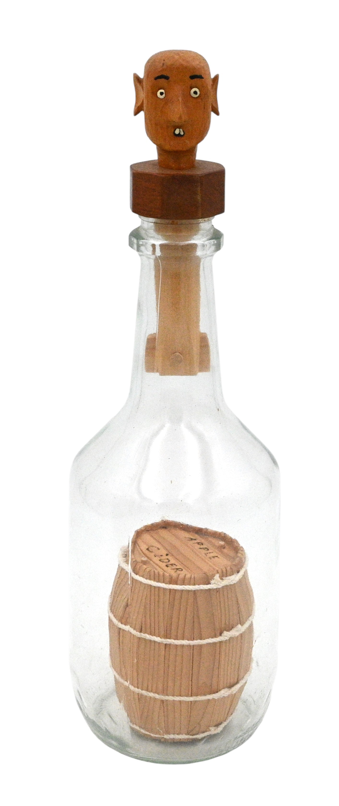 H. Campbell. Whimsey Bottle: H. Campbell. Whimsey Bottle. 1989. Signed and Dated. A barrel built inside and a lock stopper with a folky carved head. The top and bottom of the barrel were assembled from strips inside the bottle. T