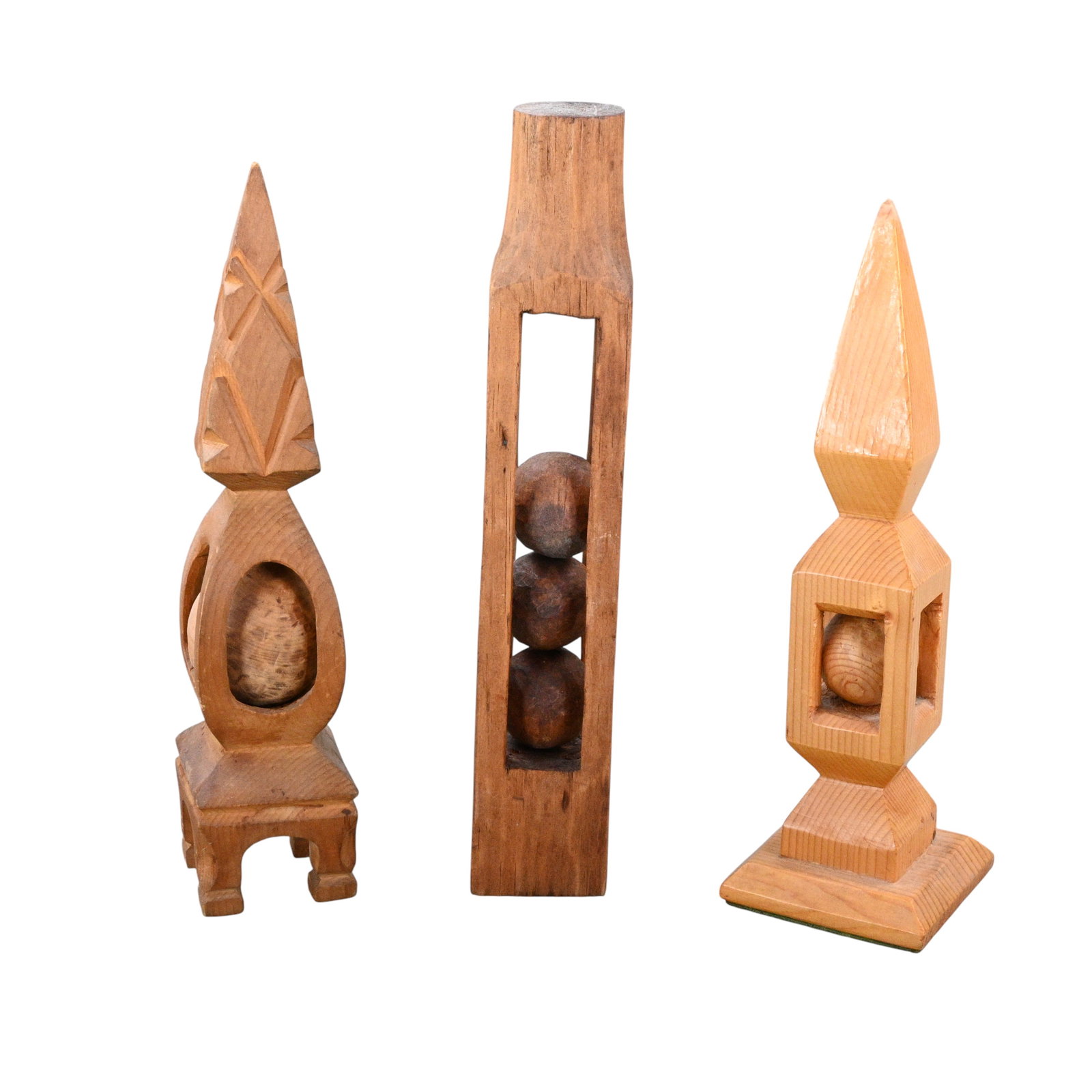 Three Architectural Whimsies: Three Architectural Whimsies. A striking group of three hand carved wooden whimsies, each presenting a contained sphere within a boldly articulated architectural form. Good condition with slight