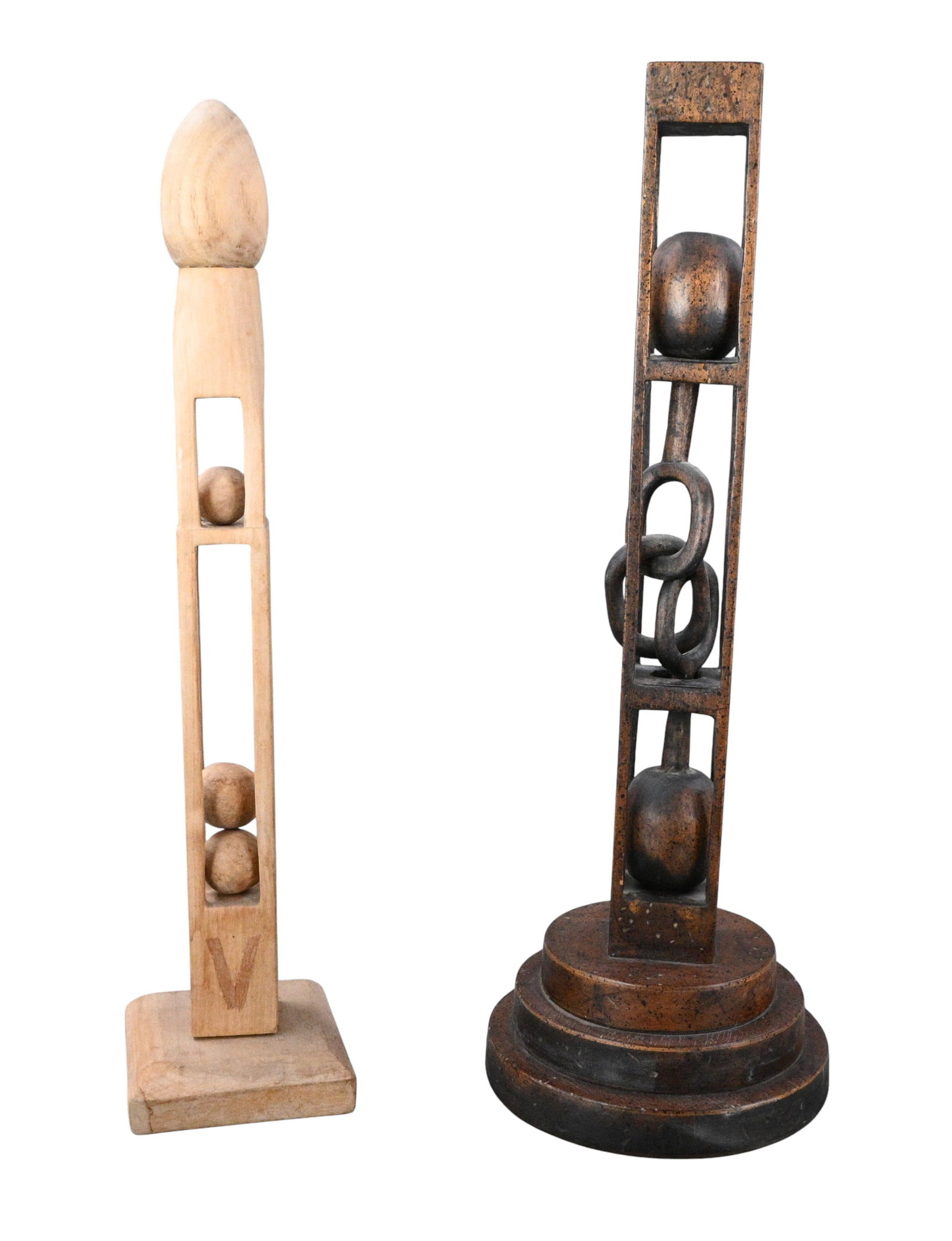 Pair of Monumental Ball-in-Cage Whimsies: Pair of Monumental Ball-in-Cage Whimsies. A powerful pair of tall, hand carved wooden whimsies with the classic ball-in-cage motif. One presents stacked enclosed spheres beneath a smooth finial, while