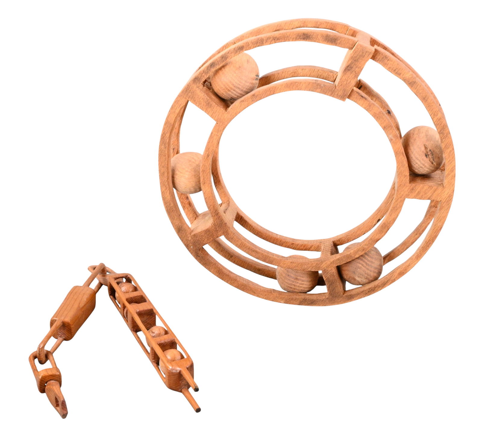 Circular Ball-in-Cage Whimsy: Circular Ball-in-Cage Whimsy. A striking group of hand carved wooden whimsies centered on circular and linear ball-in-cage construction. The large ring form example, encloses multiple fee moving spher