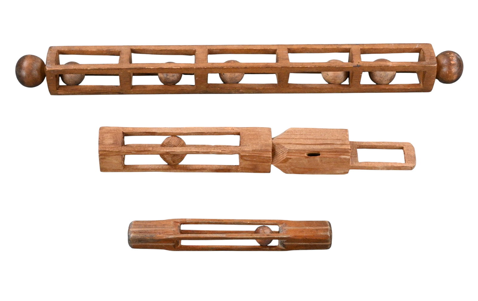 Three Ball in Cage Puzzle Whimsies: Three Ball in Cage Puzzle Whimsies. Group of carved wooden folk art whimsies, all featuring variations on the traditional ball in cage puzzle form. Carved from solid hardwoods and finished with