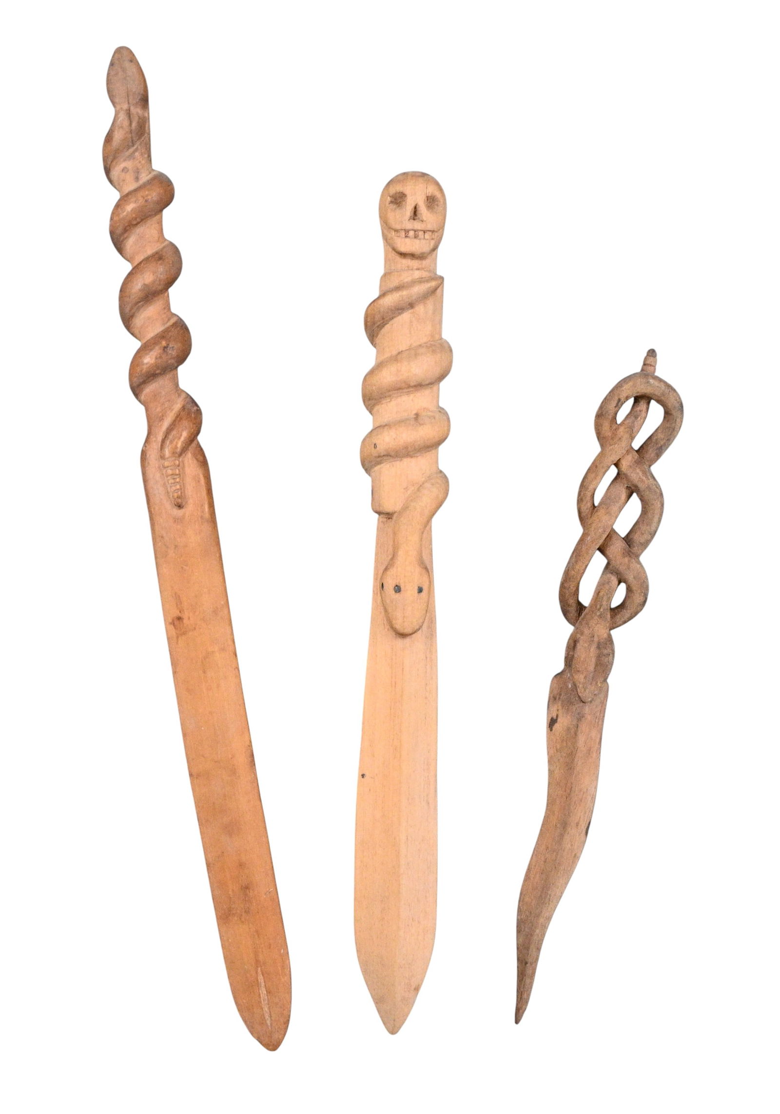 Serpents & Spirits: Trio of Hand Carved Folk Art Letter Openers: Serpents & Spirits: Trio of Hand Carved Folk Art Letter Openers. A group of three hand carved wooden letter openers, each featuring boldly whittled serpentine twists. One is topped with a skull