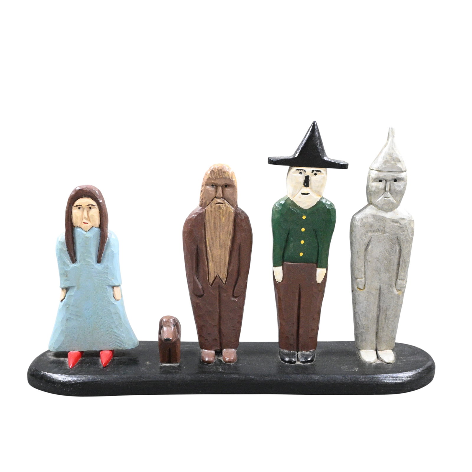 Tim Ratliff. The Wizard of Oz: Tim Ratliff. The Wizard of Oz. Signed. Carved and painted wood. Only two ever done have Toto. Excellent condition. Size: 10.5" H x 16.75" W x 4.5" D. Provenance: Prominent Private Kentucky Collection.