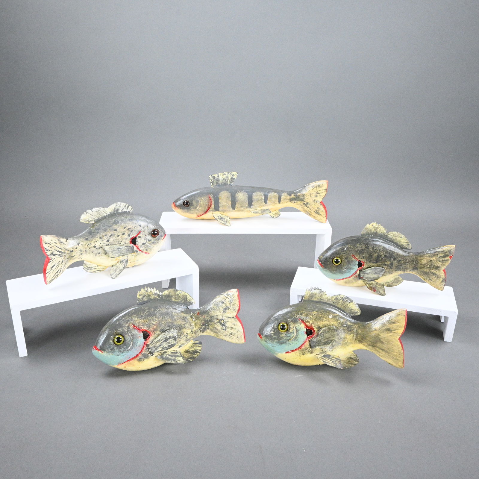 George Aho. Five Fish Decoys: George Aho. (1911-1994) Five Fish Decoys. 1993. Signed and Dated. Carved and painted wood with tin fins and weighted bottoms. Excellent condition. Size: Largest is 3.5" H x 10" W. Provenance: Private