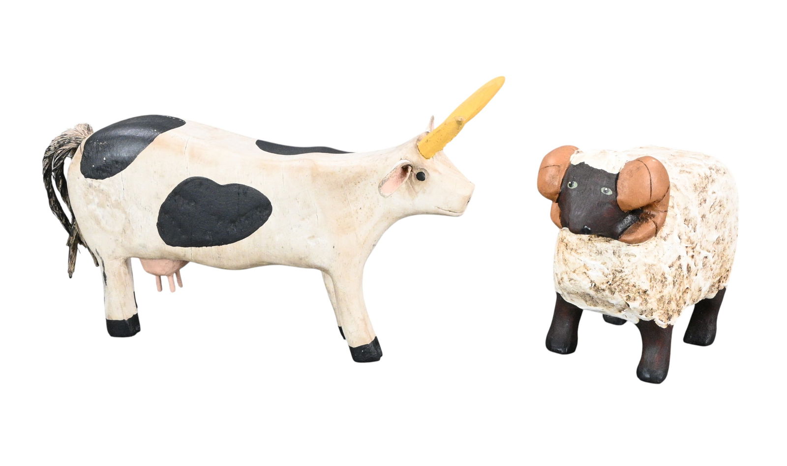 Cow and Sheep Wood Carvings: Cow and Sheep Wood Carvings. Signed and Dated. Painted wood carvings. Cow initialed and dated 1989. Sheep is signed Ted Nichols and Reb Hanson and dated 1990. Good condition. Some surface wear. Size: