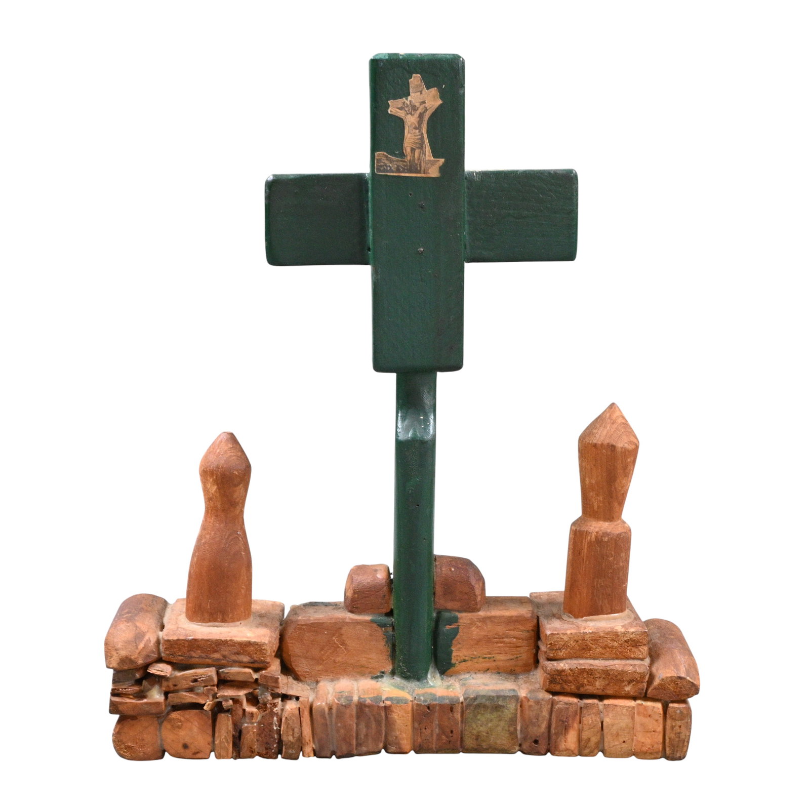 Devotional Folk Art Crucifix: Devotional Folk Art Crucifix. (1905-1998)Wood assemblage. Hand carved wooden devotional sculpture depicting a simple cross flanked by two abstract mourner figures. The cross is painted dark green