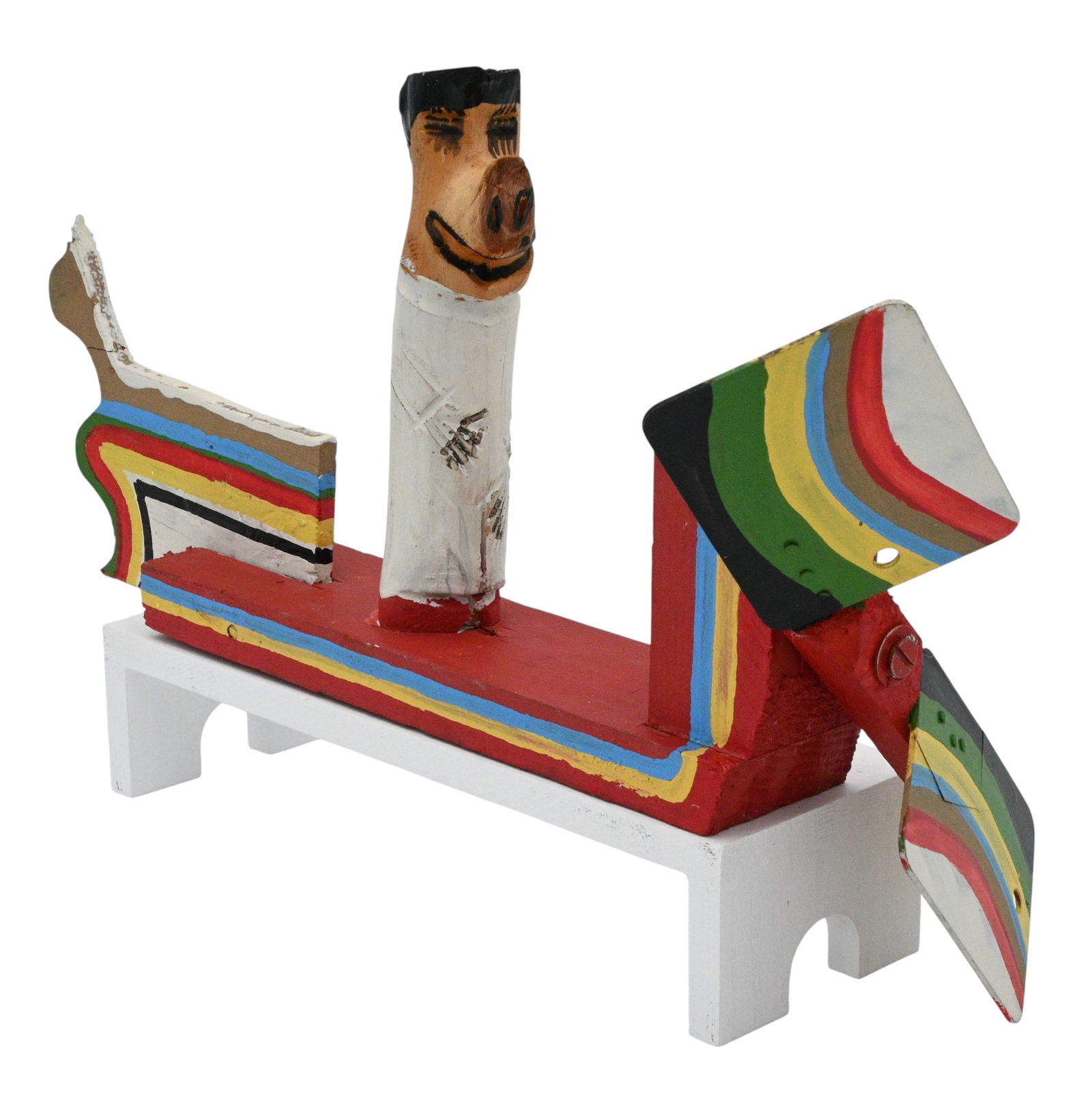 James Harold Jennings. Flying Pig Man: James Harold Jennings. (1931-1999)Flying Pig Man.Signed. Paint on wood assemblage. Good condition. Potential repair to rear. Size with Frame: 6.5" H x 14" W x 7.5" D. Provenance: Private