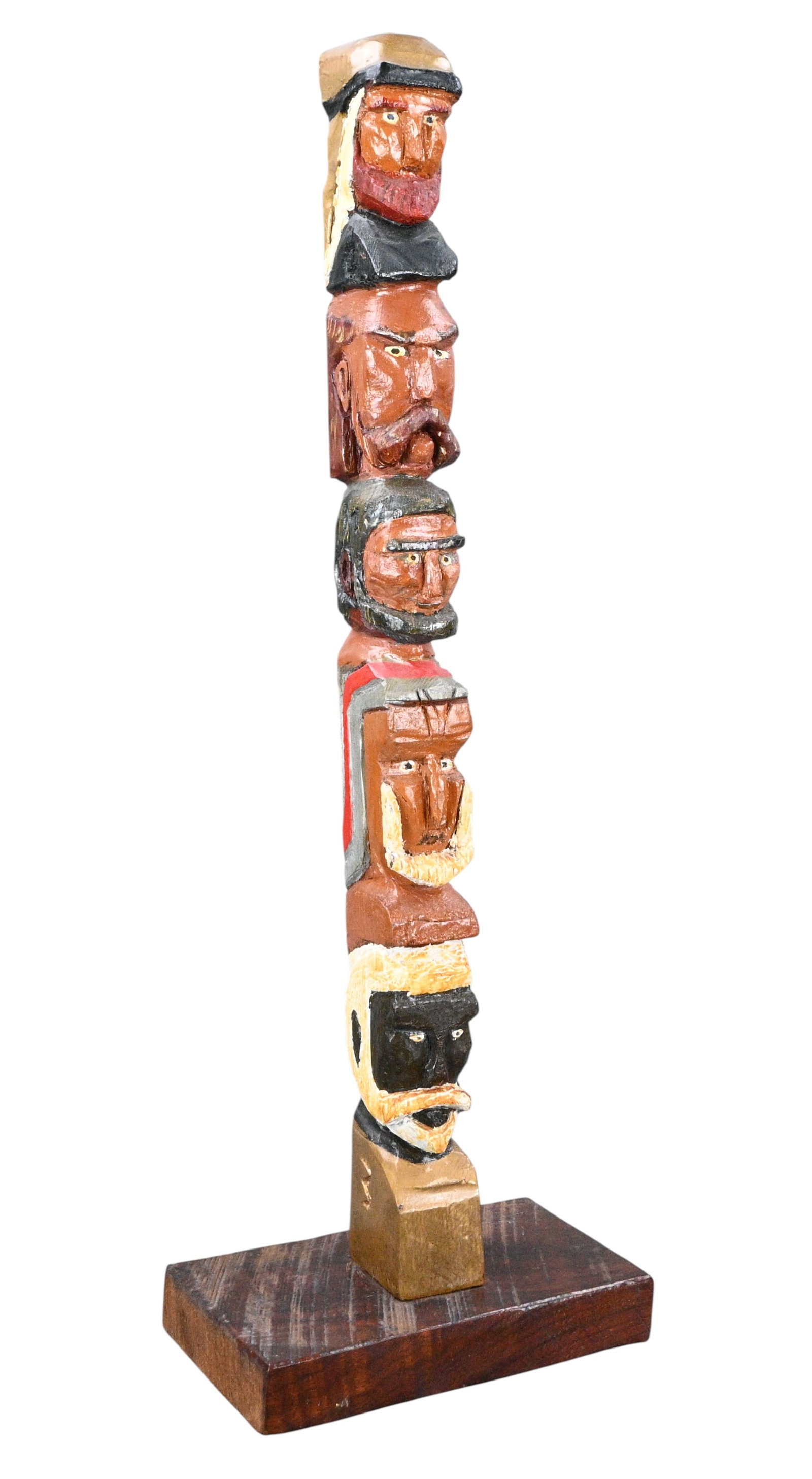 Male Head Stacked Totem Carving: Male Head Stacked Totem Carving. A hand carved and painted folk art sculpture composed of vertically stacked figural heads.. Excellent condition. Size: 20" H x 6.75" W x 4" D. Provenance: Private Flor