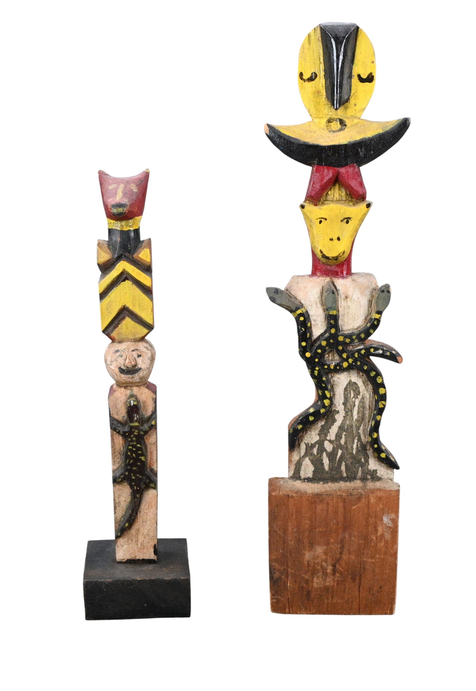 Serpent & Spirits: Pair of Carved and Painted Folk Art Totems: Serpent & Spirits: Pair of Carved and Painted Folk Art Totems. A pair of hand carved and painted folk art totem figures, each constructed from vertically stacked forms combining human, animal, and ser