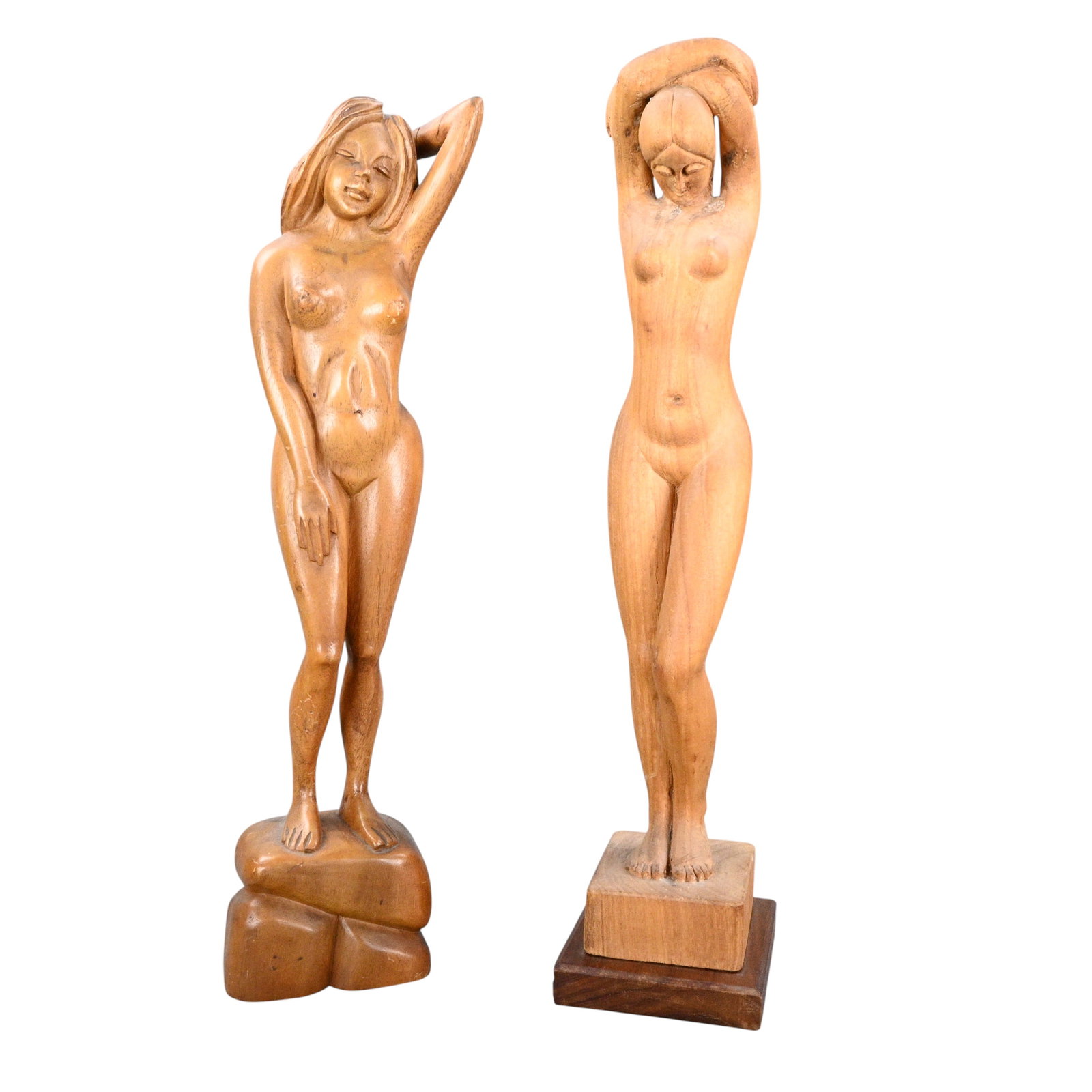 Pair of Carved Wooden Nude Female Figures: Pair of Carved Wooden Nude Female Figures. Unsigned. Pair of carved wooden figure depicting a standing nude female with arms raised above her head and another standing nude female with one arm