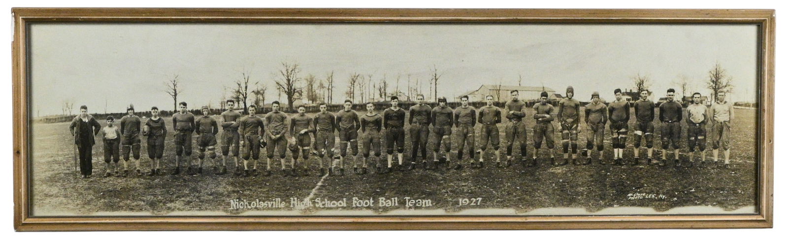 McClare Photo. Nicholasville High School Foot Ball Team 1927: McClare Photo. Nicholasville High School Foot Ball Team 1927.1927. Signed. Lexington KY. Excellent condition. Size with Frame: 10.25" H x 35.25" W. Provenance: Larry Hackley Collection. Est.