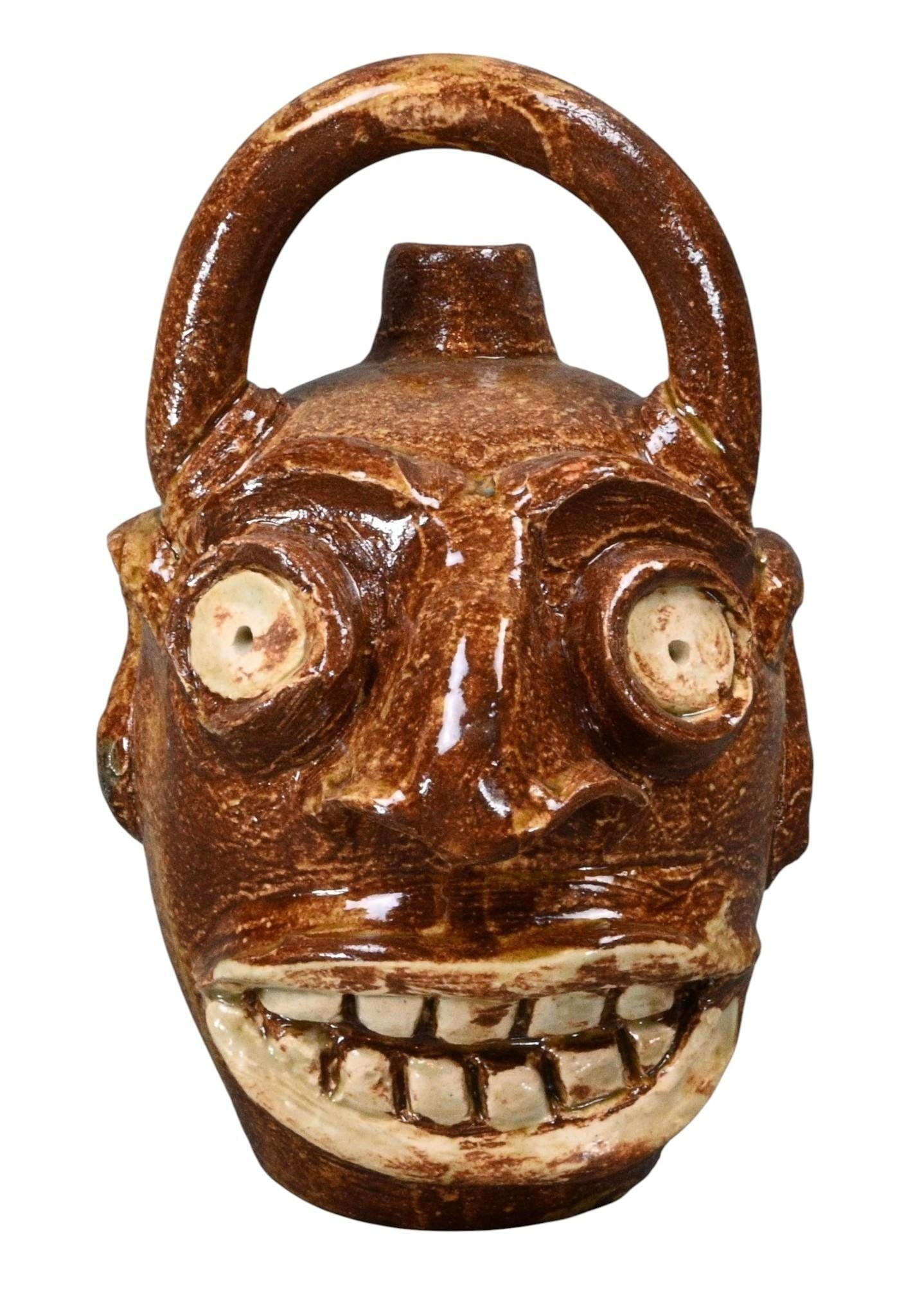 Randy Tobias. Edgefield Style Face Jug: Randy Tobias. Edgefield Style Face Jug. 2026. Signed. Mint condition. Size: 7.25" H. Provenance: Direct from Randy Tobias. Let's help support living artists. Est. $200 - $400. Ship: In-House Shipping