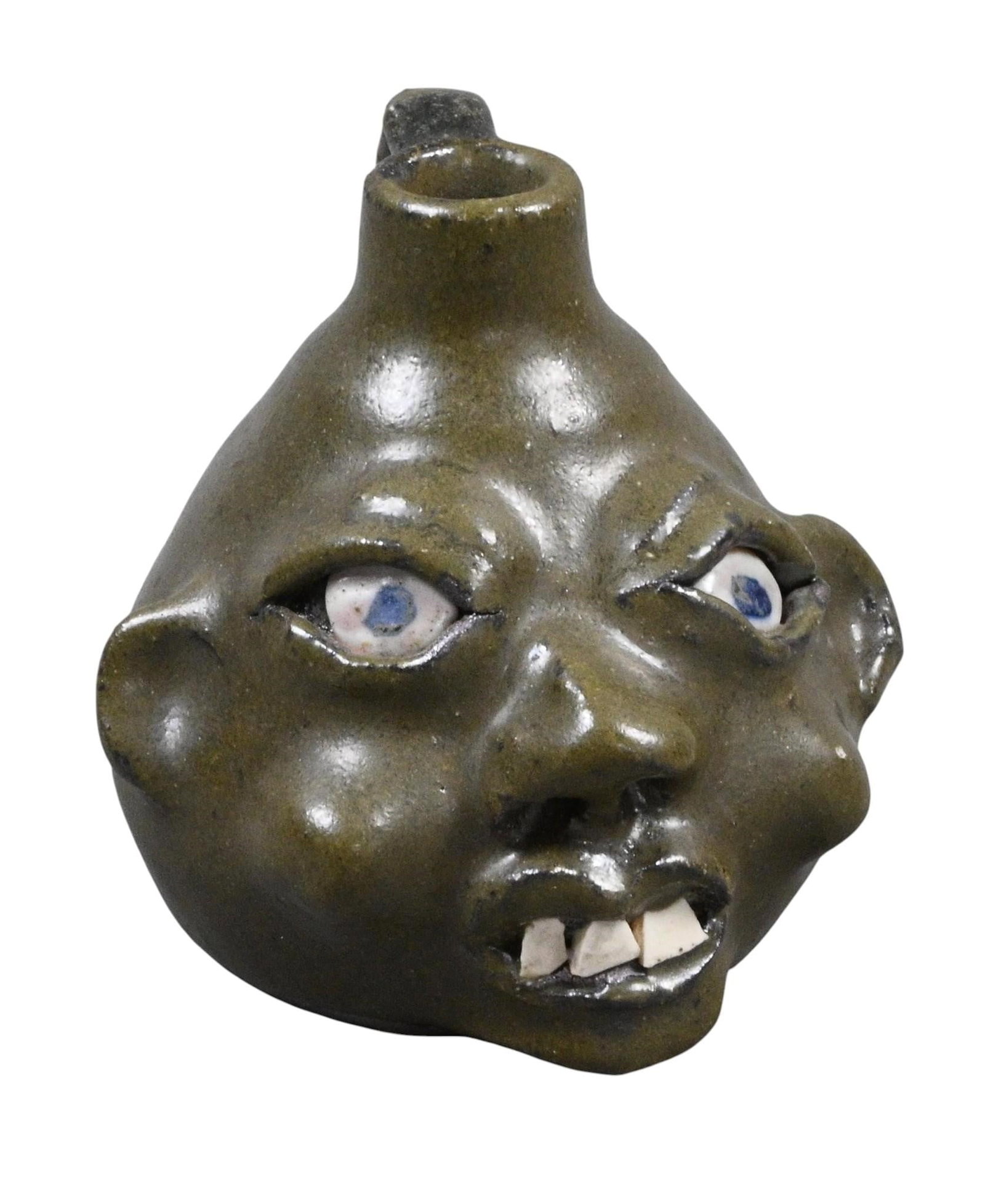Grace Nell Hewell. Mini Face Jug: Grace Nell Hewell. (1933-2016) Mini Face Jug. 1997. Signed and Dated. Mint condition. Size: 3" H. Provenance: Collection of Micki Beth Stiller. Montgomery, AL. Est. $50 - $150. Ship: In-House