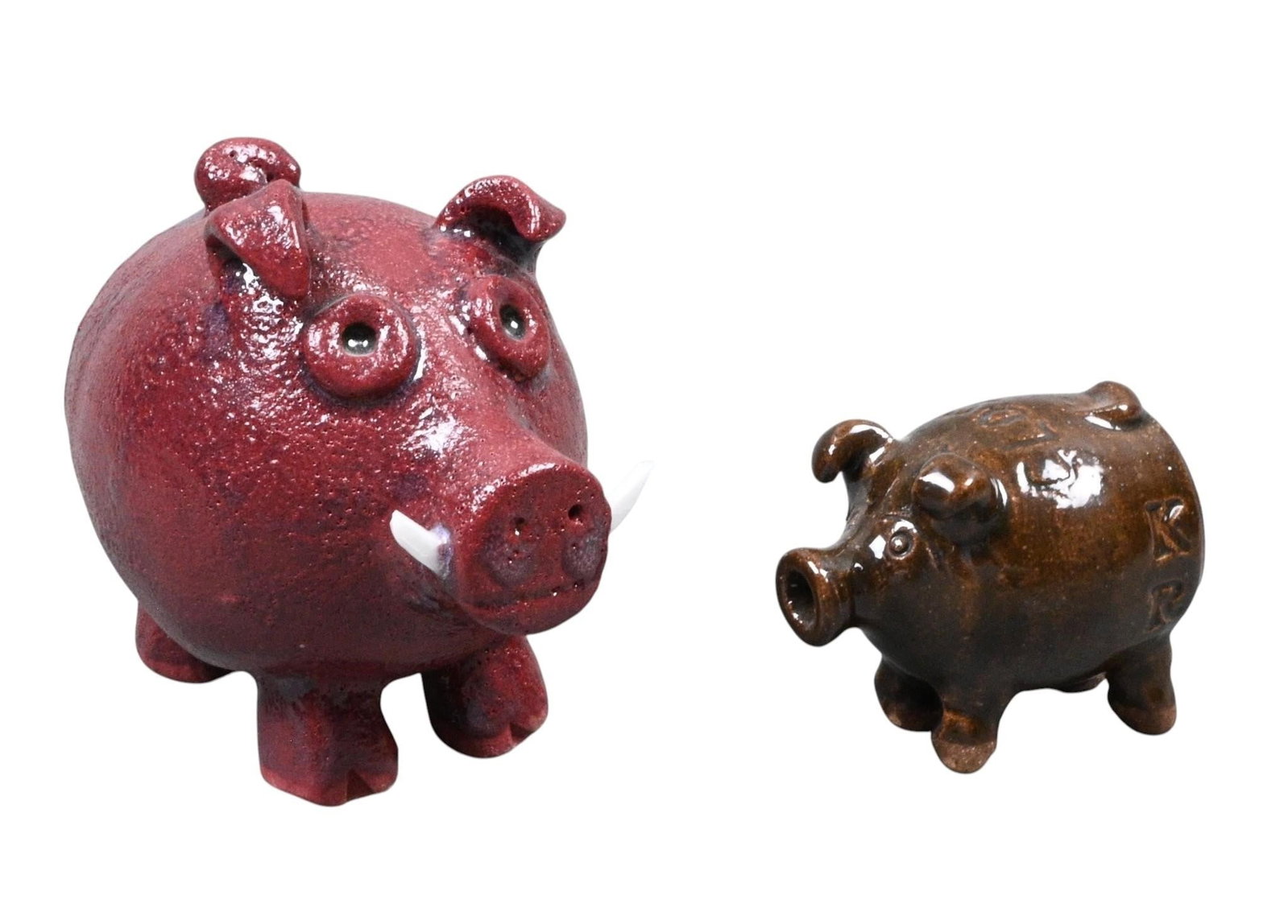 Two Mini Pottery Pigs: Two Mini Pottery Pigs. Signed. One signed Kathy Richards. Mint condition. Size: Largest is 3.5" H. Provenance: Collection of Micki Beth Stiller. Montgomery, AL. Est. $100 - $200. Ship: In-House