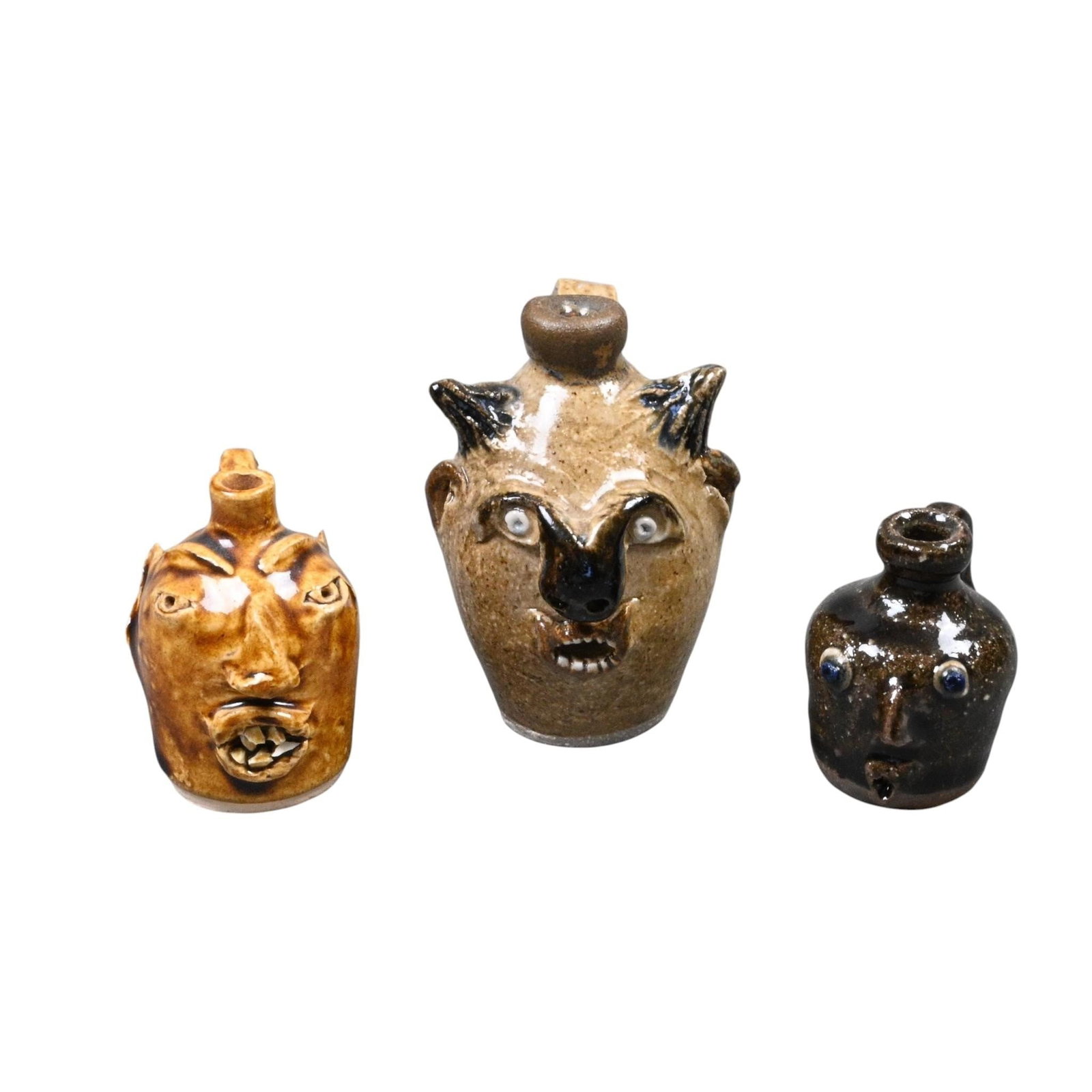 3 Mini Face Jugs: 3 Mini Face Jugs. Signed or Stamped. Brown Pottery 1986. Little Mountain Pottery. Mint condition. Size: Largest is 3" H. Provenance: Collection of Micki Beth Stiller. Montgomery, AL. Est. $100 -