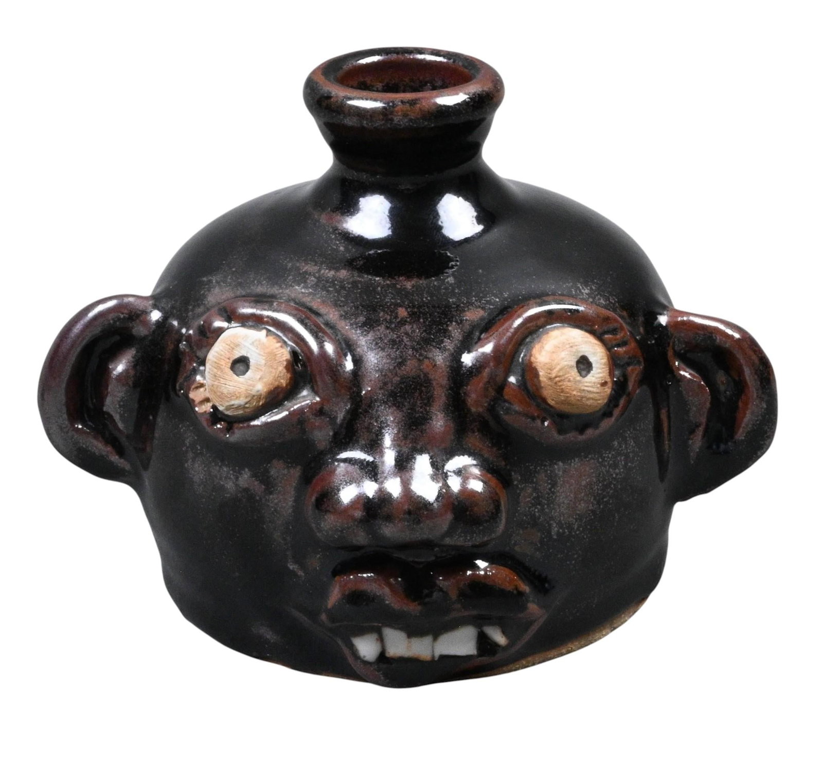 Bug Eyed Face Jug: Bug Eyed Face Jug. Initialed S on bottom. Mint condition. Size: 4.5" H. Provenance: Collection of Micki Beth Stiller. Montgomery, AL. Est. $100 - $200. Ship: In-House Shipping Available.