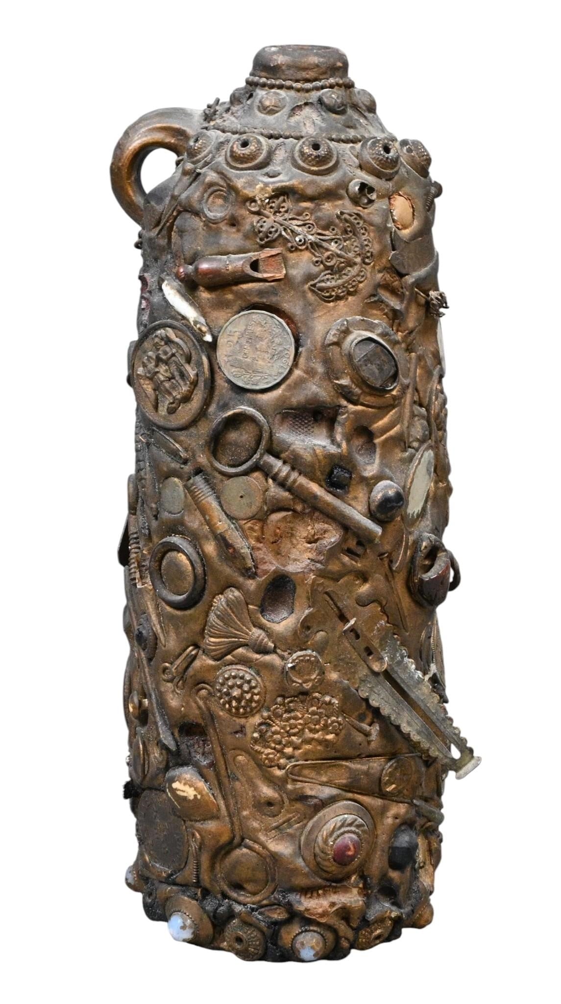 Memory Ware Covered Glass Bottle: Memory Ware Covered Glass Bottle. Not Signed. Mixed media attached to a glass bottle. One of a kind folk art assemblage vessel covered with an eclectic assortment of found objects including buttons,