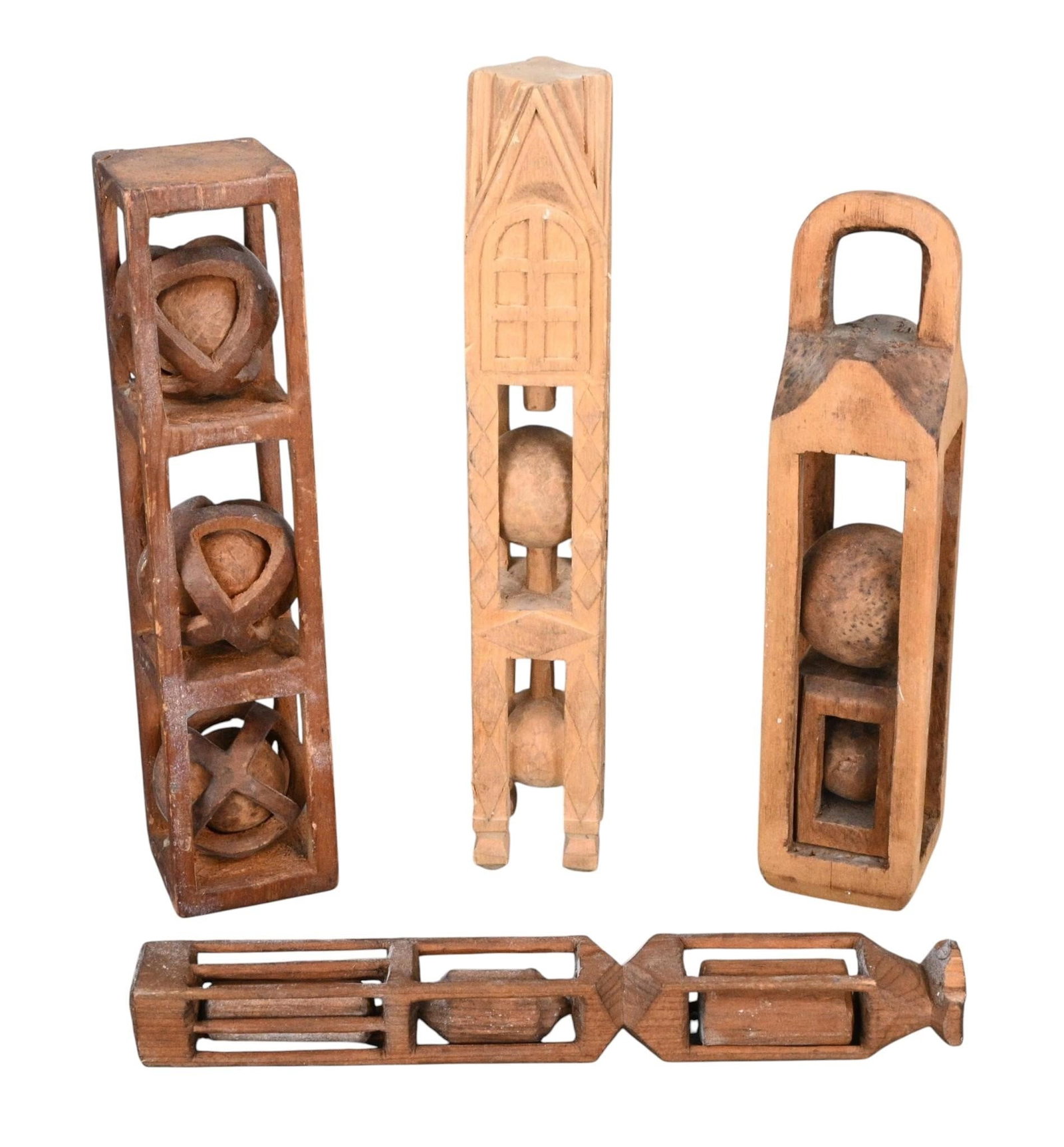 Group of Complex Wooden Carved Whimsies: Group of Complex Wooden Carved Whimsies. Not Signed. A collection of four hand carved wooden folk art whimsies. Includes a three ball carving with captive rings surround each ball, an architectural