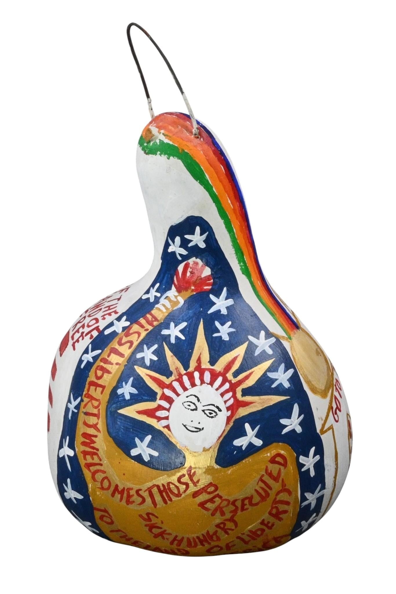 B.F. Perkins. Painted Gourd: B.F. Perkins. (1904-1993) Painted Gourd. Signed. Large painted gourd decorated with an exuberant combination of patriotic and religious imagery. The surface incorporates an American Flag, rainbow,