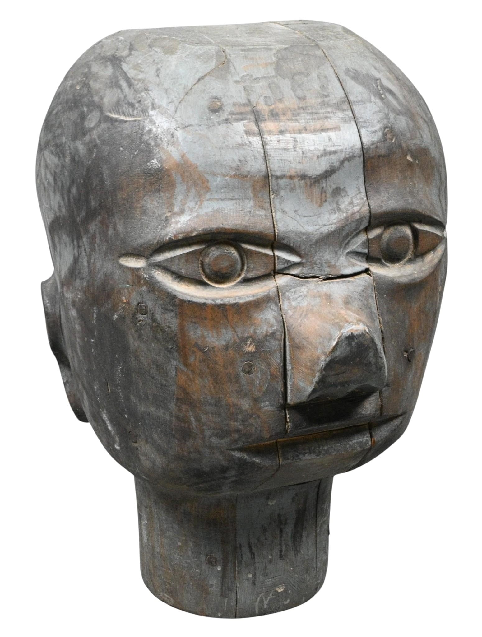 Large Modernist Hand-Carved Hardwood Folk Art Head Sculpture: Large Modernist Hand-Carved Hardwood Folk Art Head Sculpture. Not Signed. Carved wood. Hand carved hardwood sculpture depicting a stylized human head with deeply carved almond shaped eyes, broad