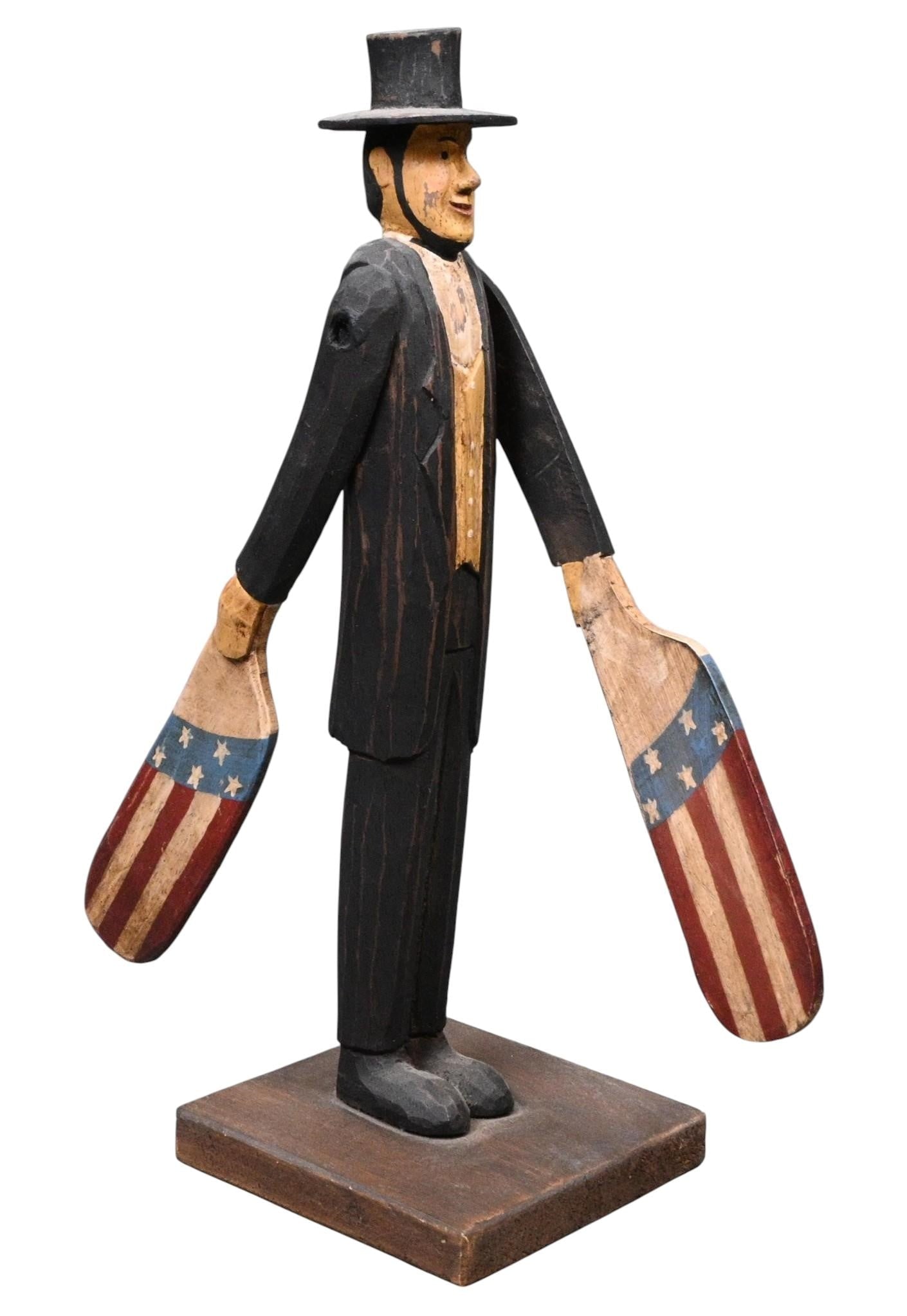 Abraham Lincoln Wood Carved Whirligig: Abraham Lincoln Wood Carved Whirligig. Not Signed. Painted wood carving. Good condition. Some paint loss. Size: 12" H x 4" W x 4" D. Provenance: Private Florida Collection. Consignor is 90 years old