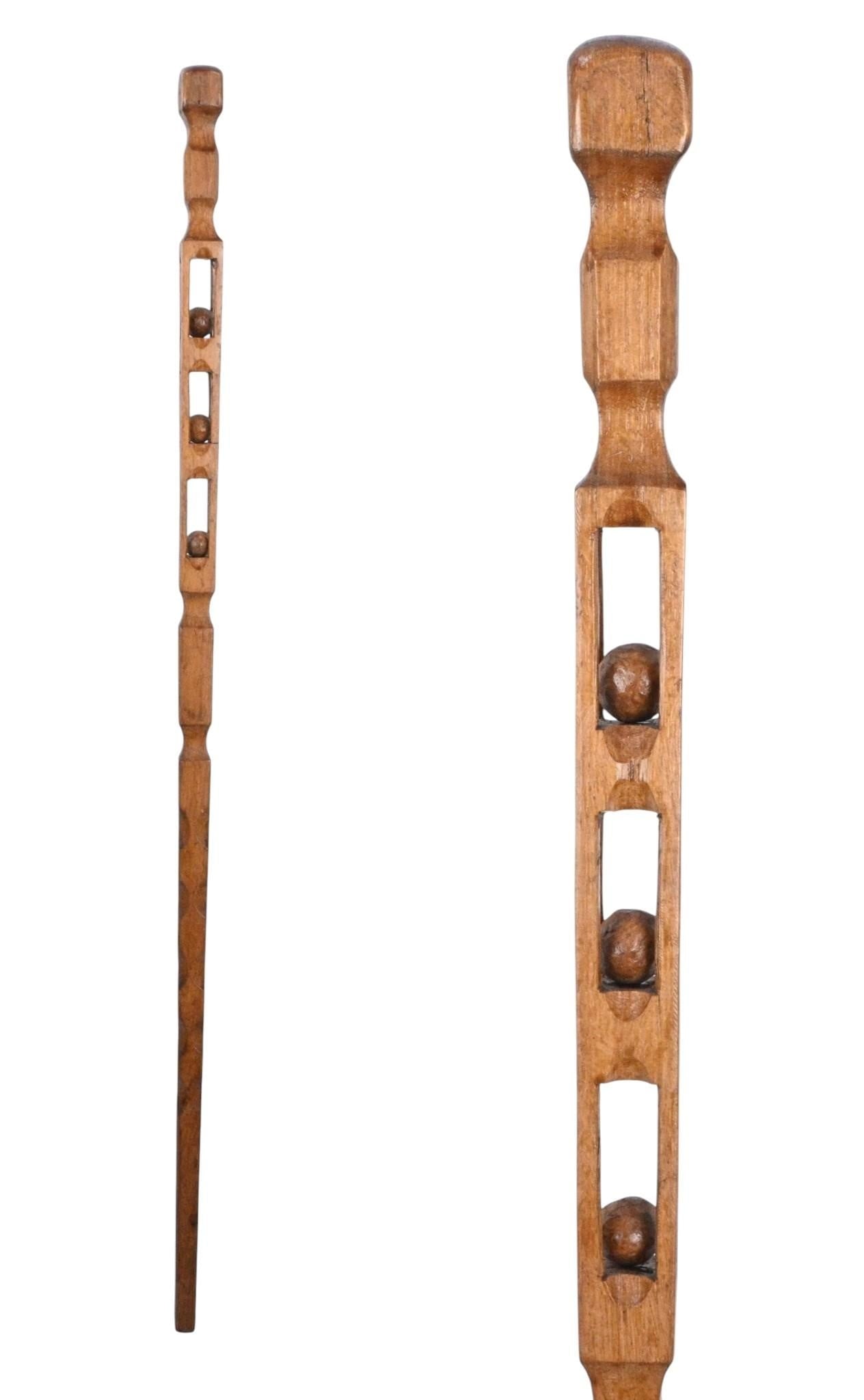 Whimsy Cane with Three Enclosed Balls: Whimsy Cane with Three Enclosed Balls. Carved wood. Hand carved whimsy cane with three wooden enclosed balls. Excellent condition. Size: 33.25" H x 1.25" W. Provenance: Private Florida Collection. Con
