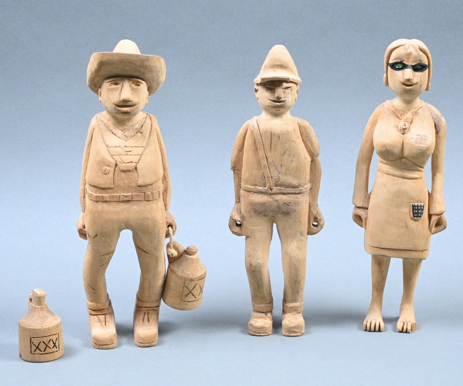 Three Wooden Carvings: Three Wooden Carvings. Initialed FV. Carved wood with ink. Good overall condition. Female figure is missing a toe. Size: Largest is 9" tall. Provenance: From the estate of Harry Zmijewski. Est. $100