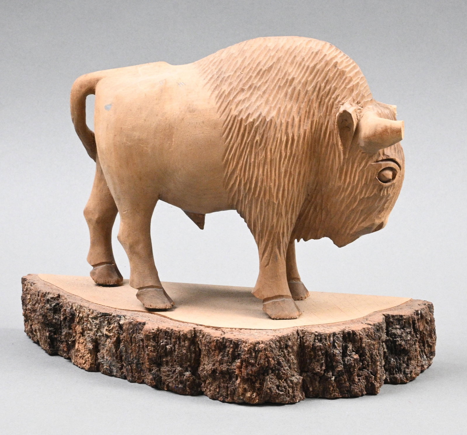 DLA Heronima Biakowieza. Wooden Carved Buffalo: DLA Heronima Biakowieza. Wooden Carved Buffalo. 1979. Fair condition. Horns have damage and backside of front leg has damage. Size: 7.75" H x 9.75" W x 4" D. Provenance: From the estate of Harry Zmije