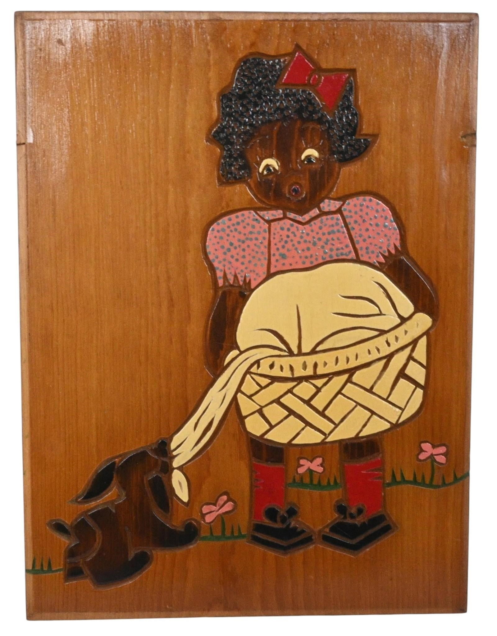 Girl with Basket & Dog Folk Art Wood Plaque: Girl with Basket & Dog Folk Art Wood Plaque. Not signed. Painted and stained cut-wood relief on wood panel. Vintage American folk art wall plaque depicting a young Black girl carrying a large woven ba