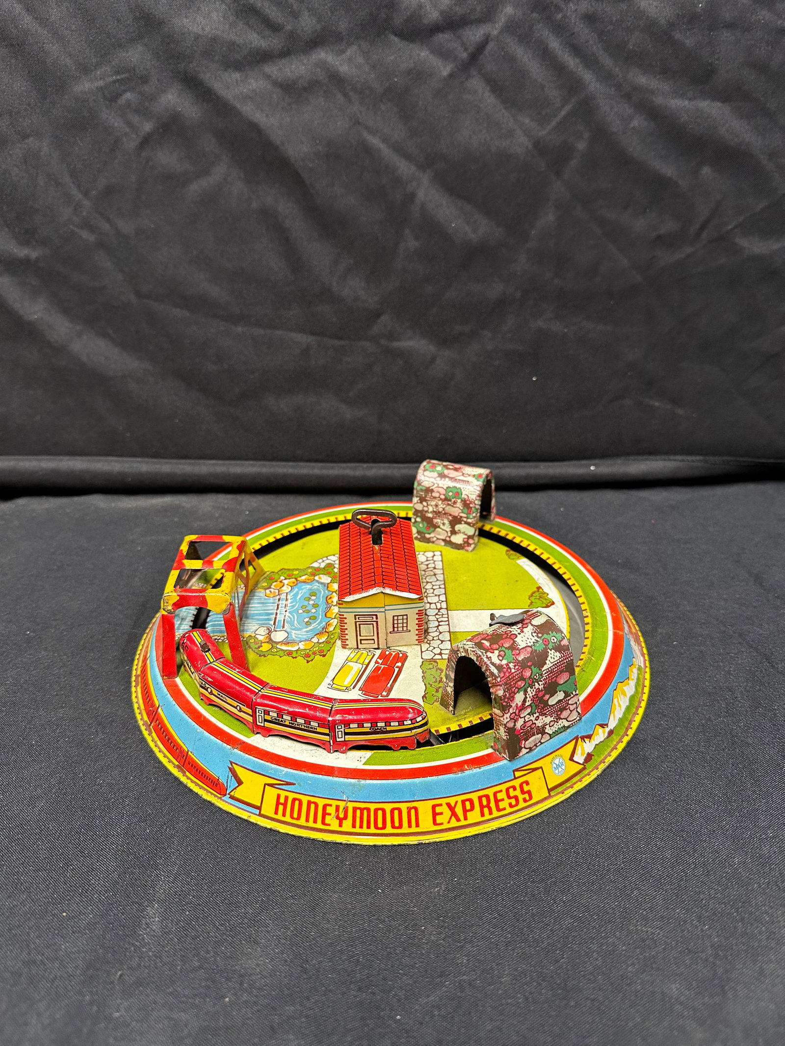 MARX TOYS HONEYMOON EXPRESS WIND UP TOY: Please see photos for conditionWorks, train gets stuck in some areas occasionally.