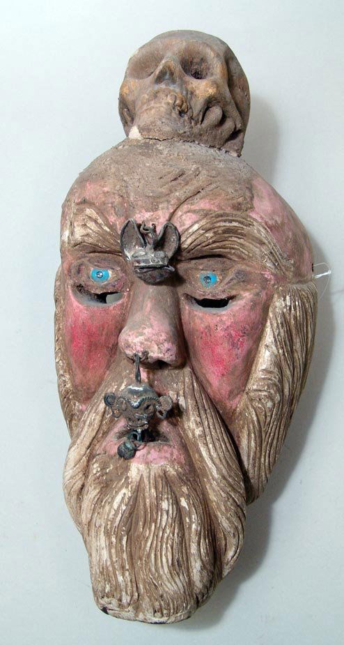 Mexico, Guerrero, mid 20th Century. A polychrome ca: Mexico, Guerrero, mid 20th Century. A polychrome carved wood mask, with cast bronze accents between the eyes and on the tip of the nose. A skull is atop the bearded face. Some losses around the base o