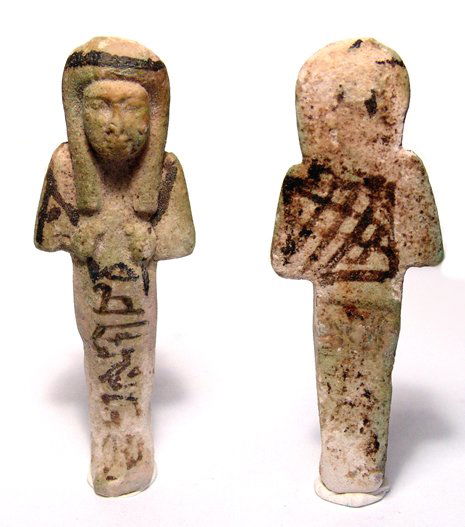 Nice 3rd Intermediate Ushabti of "Nesh-Tahi": 3rd Intermediate Period, 22nd Dynasty, 945 - 712 BC. An ushabti of 'Nesh-Tahi', intact with glaze faded to a light green. Black cosmetic details, shesh headband, pick, hoe and seed bag still strongly