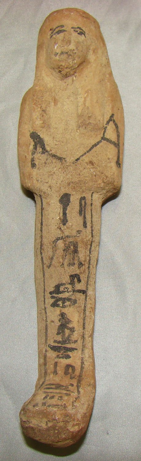 Egypt, New Kingdom, A nice terra cotta ushabti: Egypt, New Kingdom, Middle to Late Dynasty XVIII, c.1353 – 1292 BC. A nice molded terracotta ushabti of good style with crisp black line work. Intact and very nice for the type. H: 7".