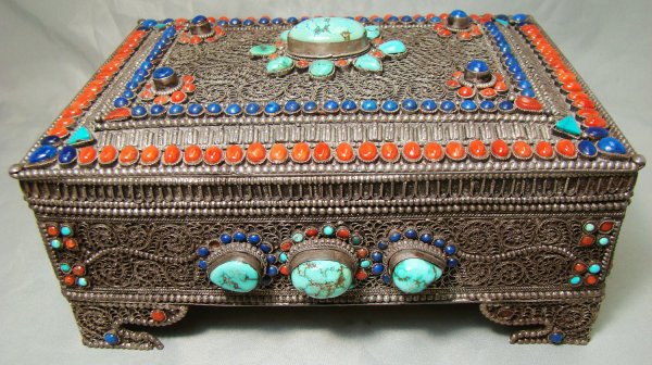 Nepal, c. late 20th century. Stunning silver box: Nepal, c. late 20th century. A stunning hand-worked silver filigree, solid silver box, studded with chunks of turquoise and set with cut and polished lapis, coral, and additional turquoise. Magnificen