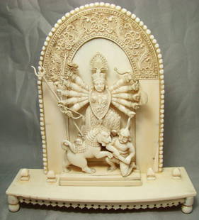 India, Late 1800's, Ivory Hindu Goddess Kali: India, Late 1800's, southwest India. Ivory Hindu Goddess Kali, the consort of Shiva, appearing in the mode of demon-killer with her multiple arms filled with weapons. A masterfully carved piece of art