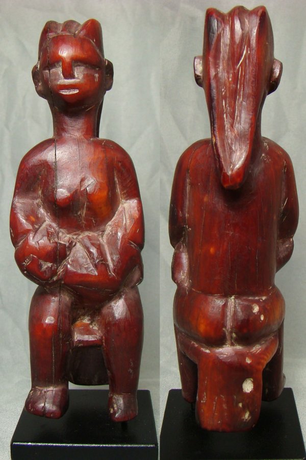 Africa, African Female Fetish in dyed ivory: Africa, African Female Fetish, c. 1950. A small vegetable dyed ivory "mother and child" totem piece. Size is 4" x 1" diameter at base. Custom stand. Old San Francisco collection. ***THIS ITEM CAN ONLY