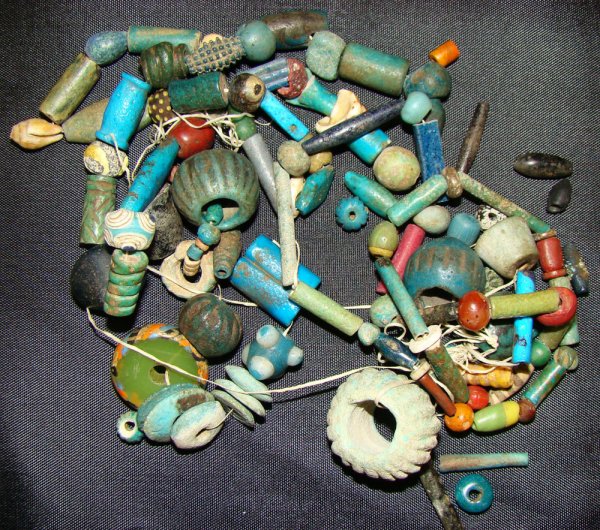 Egypt & the ancient world, a large lot of beads: Egypt and the ancient world, a lot of beads. Some in faience, glass and stone. Assorted colors and shapes. Strung into 4 pieces. Southern California collection.