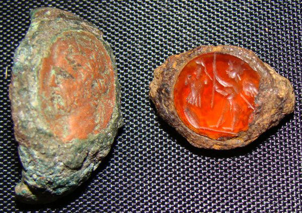 Roman, c. 100-300AD., a lot of 2 nice stones: Roman, c. 100-300AD., a lot of 2 nice stones, an intaglio and cameo that are set into ring fragments. Cameo in orange colored stone is profile of a woman facing to left. The intaglio in carnelian with