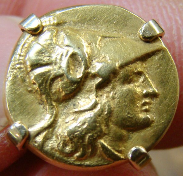A wearable tie-pin with an imitation gold stater : A wearable tie-pin with an imitation gold stater of Alexander the Great. Joel L. Malter Collection.