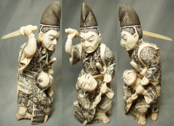 Japanese Ivory Samurai's, two battling warriors: Japanese Ivory Samurai's, c. 1900, two battling warriors. Standing warrior holds his sword behind his back while second warrior kneels directly in front as he looks upwards with his mouth agape. Exqui