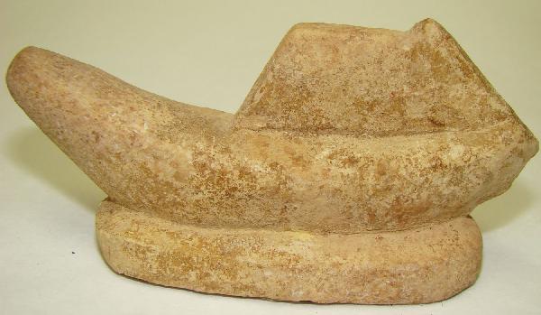 Egypt, a rare limestone model of a boat: Egypt, Late Period to Early Roman,, c. 664-30 BC., a very interesting limestone model of a small boat under sail. The boat in primitive banana shape with small sail on the aft of vessel. Boat rests on