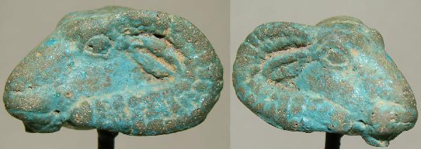 Egypt, Ptolemaic, amulet of a ram, as Khnum: Egypt, Ptolemaic Period, 300 BC. Head of a ram, as Khnum. A nice blue-glazed faience amulet. Long curving horns, hole on top of head most likely drilled to fit sun disk. Size is .75" x .75" x 1.25". C