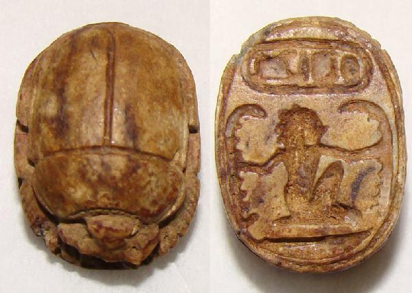 Egypt, New Kingdoms. brown-yellow steatite scarab: Egypt, New Kingdoms. c. 18th –19th Dynasties. A lovely pale brown-yellow steatite scarab. Man with outstretched holding two snakes and cartouche reading Ra men y kheper. Ex. George Beach, Wisconsin 