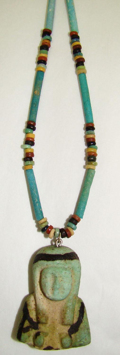 Egypt, wearable single strand "mummy" bead necklace: Egypt, Late Period, 20th-30th Dynasties, 715-332BC., an attractive and wearable single strand necklace consisting of small and tubular multi-colored faience "mummy beads". The pendant is the upper tor